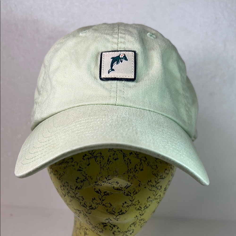Red Jacket light green cap with a Dolphin logo in front and Floridian on back.